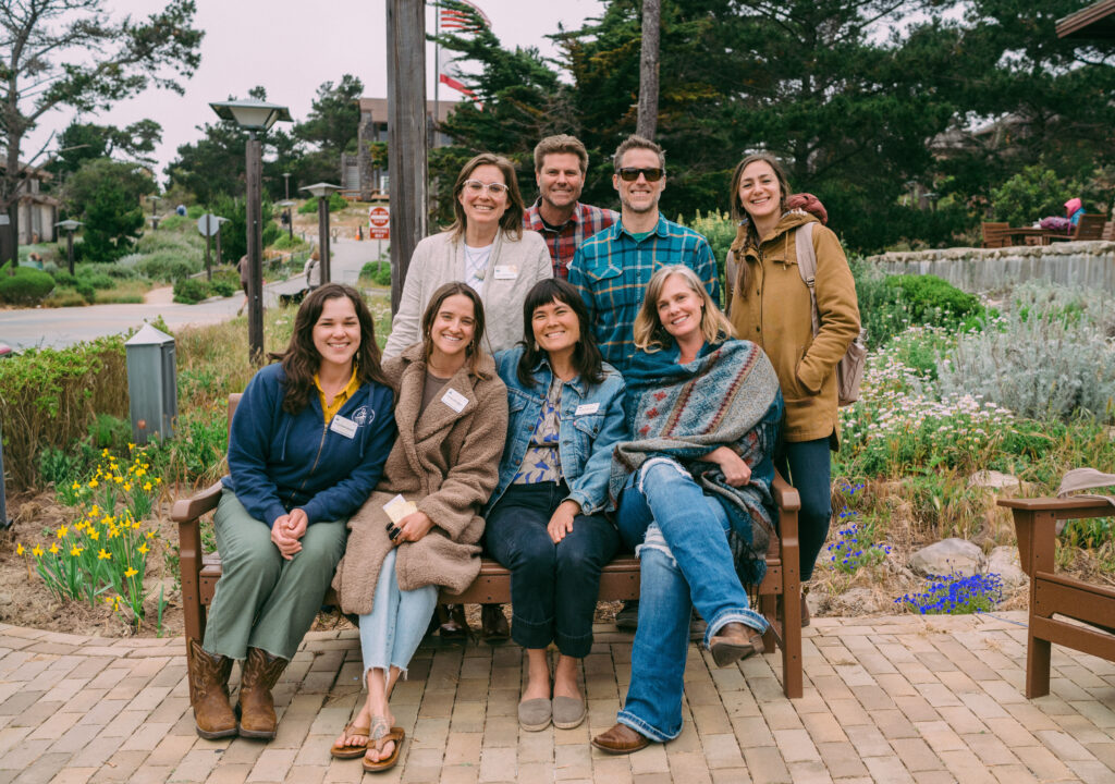 A group of smiling people gathered together.